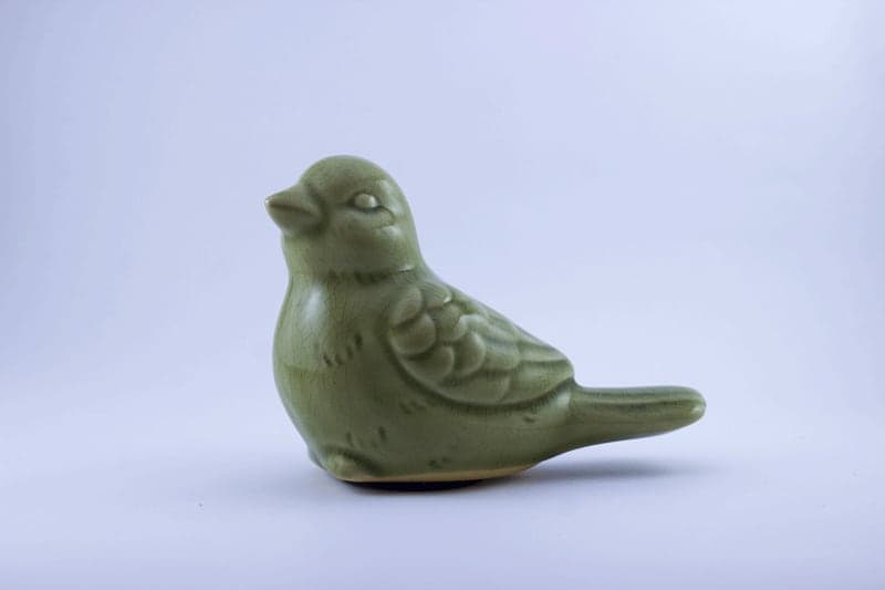 Fotografia de produto — pássaro cerâmico — fotografia 1
